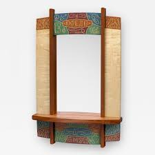 Apply painter's tape and paper over the mirror before starting to paint. Mark Del Guidice Entryway Mirror