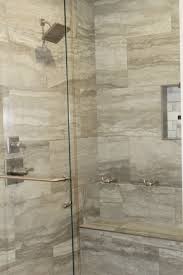 The Master Shower Features Gray Travertine Tiles Glass Doors And Multiple Shower Heads Master Shower Multiple Shower Heads Travertine Tile