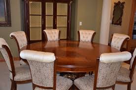 The marble look glass top is elegant while the base is architectural and abstract. The 76 Round Dining Table With Inlay Seating For 8 Italy By Web