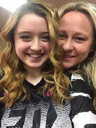 I prefer Katie's own hairstyle