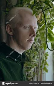 Albino Guy Green Plants Dark Background — Stock Photo © Cavan #646066148