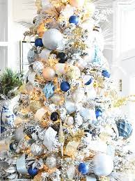 Elegant white christmas tree with blue decorations. Pin By Boutique Chic On Xmas Ideas Blue Christmas Tree Decorations Elegant Christmas Trees Blue Christmas Decor
