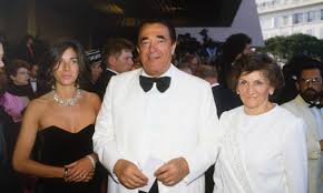 In the picture, maxwell is seen staring at the camera with a tray of food and two drinks. The Murky Life And Death Of Robert Maxwell And How It Shaped His Daughter Ghislaine Jeffrey Epstein The Guardian