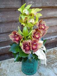 Cymbidium Orchids In A Vintage Vase Fresh Flowers Arrangements Flower Arrangements Orchid Arrangements