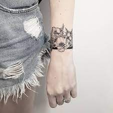 Delightful Wrist Band Tattoo Designs For Girls Simple Wrist Tattoos Wrist Tattoos Mini Tattoos