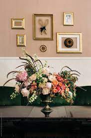 The reason the living room is so important is because it's the primary social space in the home, whether among the residents themselves or invited guests as well. Beautiful Flower Bouquet In Quaint Living Room By Visualspectrum Flower Arrangement Vintage