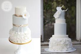 Hand painted wedding cake with wafer paper flowers. Wafer Paper Flowers Wedding Cakes In Pale Blue By Cove Cake Design Left And Hey There Cupcake Right Via Th Wafer Paper Flowers White Wedding Cakes Paper Flowers Wedding