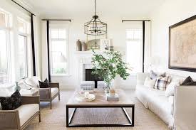 A white sofa matching the wall and floors sets the stage for cream vintage joe. Living Room Table Decor Home Design Ideas