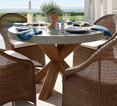 Pair this table with matching chairs from this collection to complete your dining ensemble. Abbott Indoor Outdoor 48 Concrete Fsc Acacia Round Dining Table Brown Pottery Barn