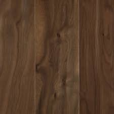 Mohawk hardwood flooring features a variety of innovations in green initiatives, including using reclaimed wood for use in their engineered flooring collections. Home Depot Mohawk Natural Walnut 3 8 In Thick X 5 In Wide X Random Length Soft Scraped Engineered Hardwood Flooring Mohawk Hardwood Flooring Natural Walnut