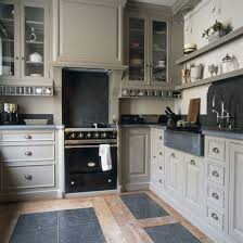 Small Elegant Kitchen With Taupe Gray Cabinets Dark Stone Countertops Baden Baden Brussels Cuisines Design Cuisine Grise Cuisine Gris