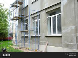 A fresh, new look can be given to any exterior plaster wall by applying a surface treatment of paint, portland cement paint, or other coating. Renovating Facade Image Photo Free Trial Bigstock