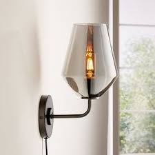 A warm gold finish and adjustable features are the main focus of this contemporary wall light. 17 Plug In Wall Sconce Ideas Plug In Wall Sconce Wall Sconces Sconces