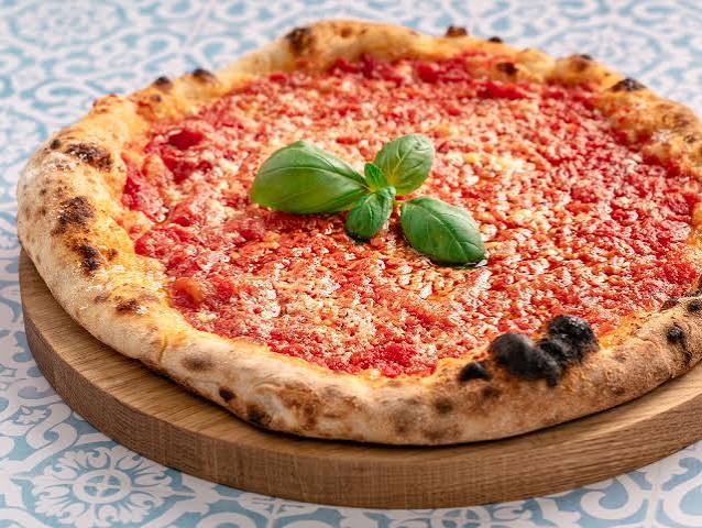 Extra Cheesy Vegetable Pizza prepared in our Signature Kitchen Style