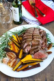 For a beef tenderloin recipe that's perfect for holiday entertaining, coat the tenderloin in a spice mixture of cumin, nutmeg and red pepper before roasting and garnish with fresh rosemary sprigs. Porcini Crusted Beef Tenderloin For Christmas Pook S Pantry Recipe Blog