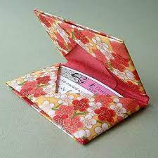 These machines use carbon paper to make a physical copy of the credit card on a sales slip by imprinting the image on the paper after a heavy block is swiped over the actual card. Card Holder Origami Cards Origami Gifts Origami Card