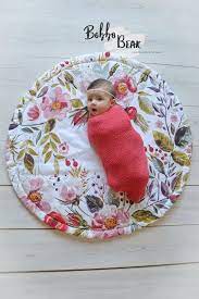 It's made from two layers of cotton with batting between, and quilted in a large grid pattern. Wildflower Play Mat Roundie For Baby Girls Nursery Baby Girl Quilts Baby Sewing Projects Diy Baby Stuff