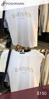 Balmain Black And Gold T Shirt Balmain Logo T Shirt White Balmain Logo T Shirt With Gold Lettering And Gold Hardware Size 34 Fr Worn Only A Few Times With No Vi Tshirt Logo Balmain T Shirt