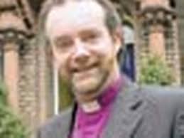Bishop calls for gay clergy talks as canon quits