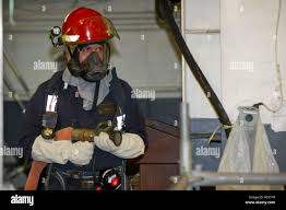SAN DIEGO (Nov. 12, 2015) Aviation Maintenance Administrationman 2nd Class Stephen  Halley sets a boundary during a fire drill aboard the amphibious assault  ship USS America (LHA 6). America is undergoing a
