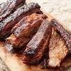 The spare ribs are cut in half to straighten them out. 1