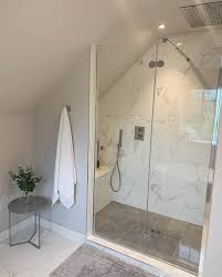 An attic bedroom and bathroom combined. How To Decorate A Bathroom With A Sloping Roof Design Porcelanosa Trendbook Ensuite Shower Room Small Attic Bathroom Bathroom Interior Design