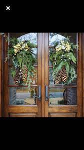 Pin By Kathy Owenby On Double Door Decor Outdoor Christmas Decorations Outdoor Christmas Christmas Front Doors