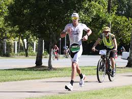 Competitors transitioning from the bike leg to the run in the ironman cairns 70.3 teams race on sunday. Pvzjq90btm6him