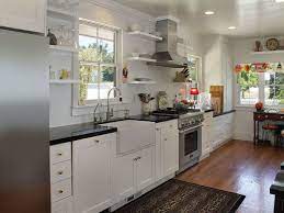 As a result, the space appears more expansive than it truly is. One Wall Kitchen With White Shaker Cabinets Farmhouse Sink Hardwood Floors And Arabi One Wall Kitchen Kitchen Designs Layout Farmhouse Style Kitchen Cabinets