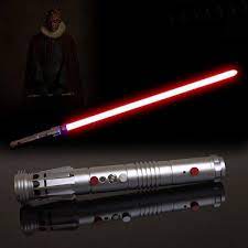 The Sith Apprentice Darth Maul Wields A Double Bladed Lightsaber Made By Joining Two Hilts Together End To End Mau Darth Maul Lightsaber Darth Maul Lightsaber