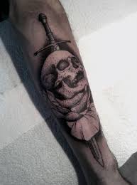The sword and skull tattoo represent death. Skull And Sword Tattoo Tattooimages Biz