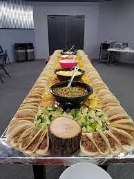 This satisfying and delicious taco bar is perfect for serving a crowd from any event from game day to movie night to a family party. Extreme Taco Bar For A Office Or House Party Food Buffet Food Mexican Food Recipes