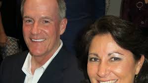 Locals toast engagement of on-the-go couple