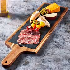 Long serving board with handle. Acacia Wood Serving Board 68cm At Drinkstuff