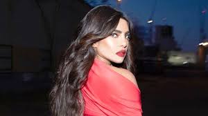See her new highlighted look. Priyanka Chopra Picked A Head To Toe Red Look To Promote Nick Jonas S New Spaceman Video Vogue India