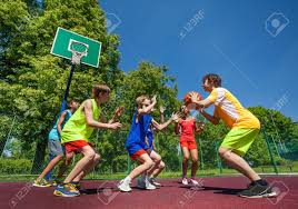 Find the perfect teens playing basketball stock photos and editorial news pictures from getty images. Teenage Children Playing Basketball Game Together On The Playground During Sunny Summer Day Stock Photo Picture And Royalty Free Image Image 43606614