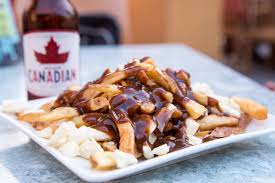 French fries are topped with cheese curds and drenched with homemade hot gravy, easy and view image. What Is Poutine And Whay Are Canadians Fascinated By It
