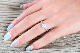 Big discounts on diamonds · factory direct jewelry! Diamonds Wedding Engagement Rings On Female Finger With Blue Stock Photo Picture And Royalty Free Image Image 106414890