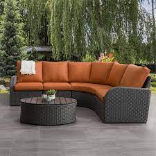 In a rainy region, resin furniture holds up well and comes in multiple designs to match any style. Corliving Curved Sectional Patio Set Charcoal Grey Orange 5pc Lowe S Canada