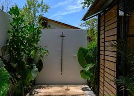 This outdoors shower is actually set under an open roof of sorts, but it is meant to feel like bathing on a waterfall. Outdoor Shower Ideas 16 Diys To Beat The Heat Bob Vila