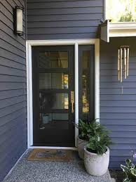 Wide strips of glass allow sunlight to pour through, keeping the door. Black Entry Doors Pella