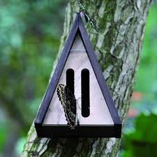 The back sliding wall was painted white to deter caterpillars from forming their chrysalises where they could be injured when opening. Butterly House Triangle Wood Plenty Mercantile Venue