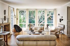 It stands a bit lower than the couch and is useful for adding reading lamps, plants, and other pieces of decor. 10 Furniture Arrangement Tips For A Lively Living Room