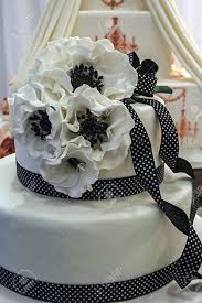 Maybe you would like to learn more about one of these? Wedding Cake Specially Decorated With Black White Ribbons And Edible Flowers Stock Photo Picture And Royalty Free Image Image 18893687