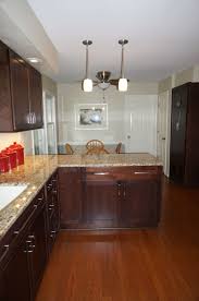 Merillat Classic Cabinetry Cherry With Pecan Stain Full Overlay Tolani Flat Panel Door S Kitchen Remodel Design Kitchen Decor Apartment Italian Kitchen Decor