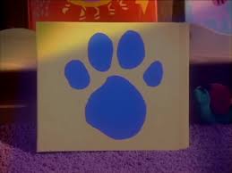 Blue is a puppy who puts her paw prints on three clues. Blues Clues Yellow Book Logo