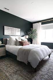 Time and again, experts will cite green as the best colour to paint a bedroom. Dark Green Guest Room With Boho Style The Diy Playbook Green Bedroom Walls Green Master Bedroom Bedroom Decor Dark