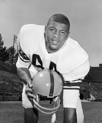 Ernie Davis, The Elmira Express! He led Syracuse to win a national  championship. He was the first Black player awarded the Heisman Trophy, and  he was the #1 NFL draft pick in
