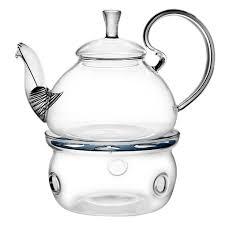 A glass teapot with infuser is the best display for the aesthetic appeal of blossoming tea and loose leaf teas. Elegant Glass Teapot Warmer Combo Flower Pot Tea Company