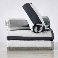 It has a classic rectangular shape and a negative monogram on the reverse side. Gray Beach Towels Target